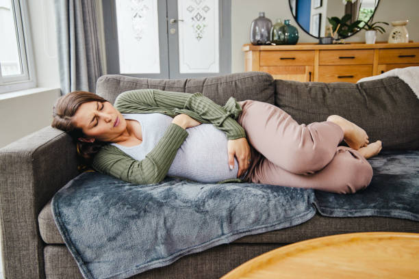 Sick Pregnant laying in the couch