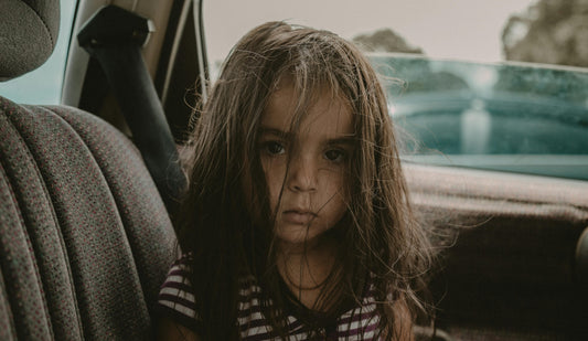 Girl with Messy Hair Sitting inside a Car